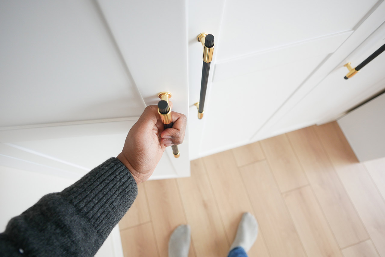 Hand opening bedroom cabinet door stock photo
